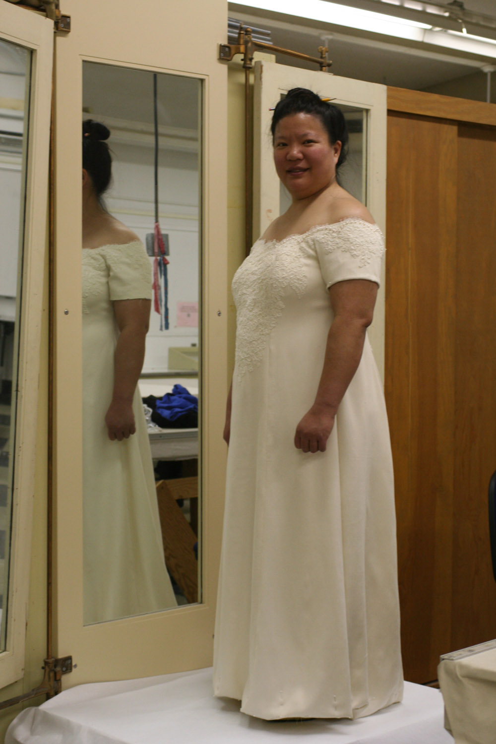 handwoven wedding dress, three-quarter view
